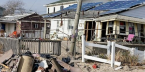 A community of homes with wreckage after a disaster