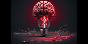 Red lightbulb with a brain on top and a cord laying underneath