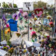 Memorial of Marjory Stoneman Douglas High School attack. Fence with flowers, candles, and notes.